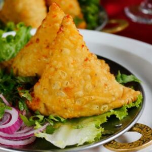 Close-up of crispy large meat samosas